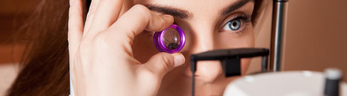 Beautiful adult woman patient during an eye examination at the eye clinic. Ophthalmologist. medical, health, ophthalmology concept